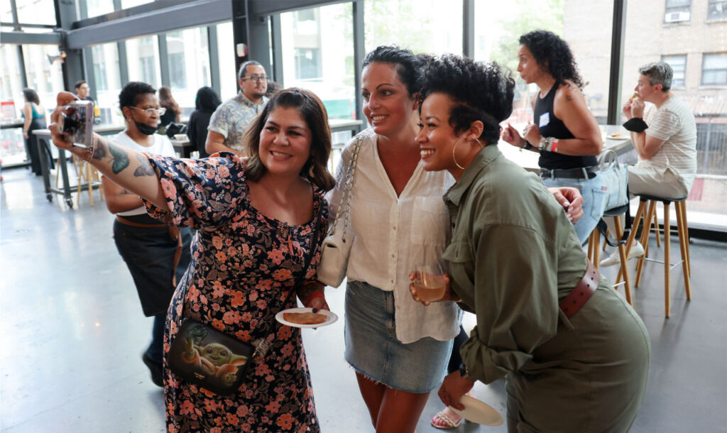 Candid of Amber in a Group Photo at an Event